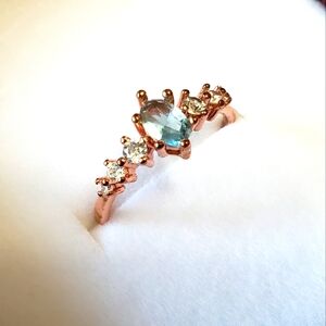 Rose gold tone ring with blue Crystal and Rhinestone size 7